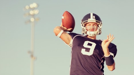 a quarterback throwing a football