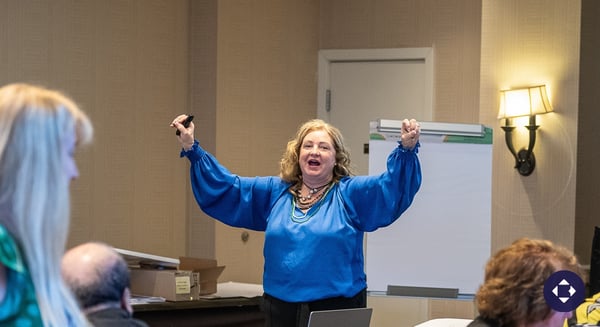 Blog Post Hero: Becky Pike Pluth leading an energetic, participant-centered training session at a Bob Pike Group workshop