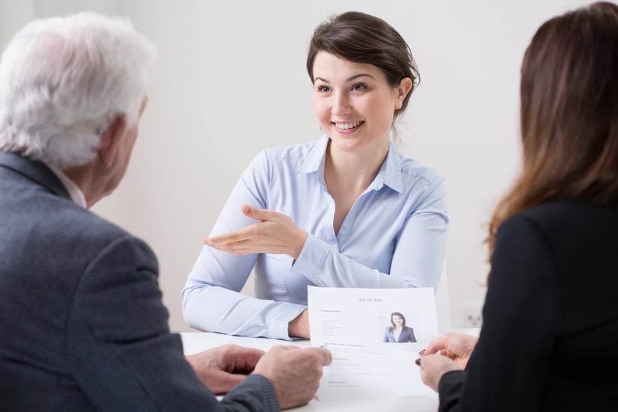 Blog Post Hero: Human resources team during job interview with woman
