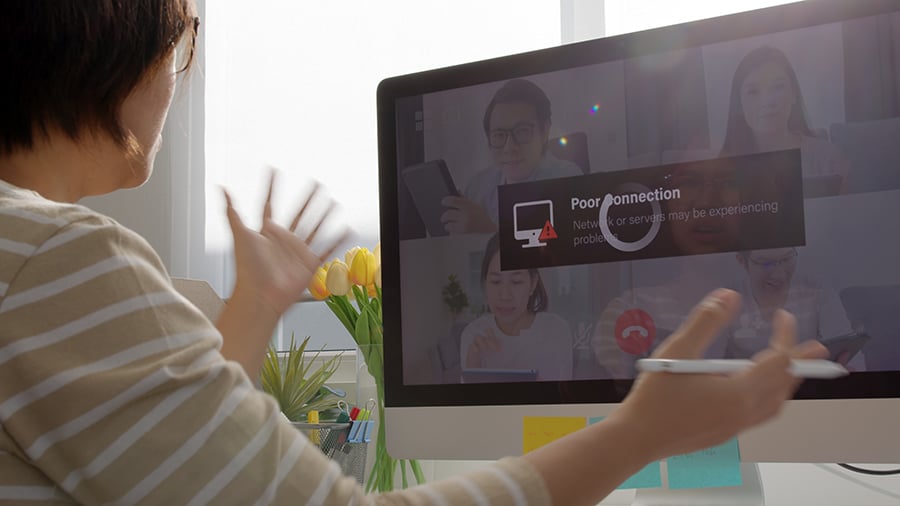 Blog Post Hero: a woman on a zoom call suffering from a poor connection