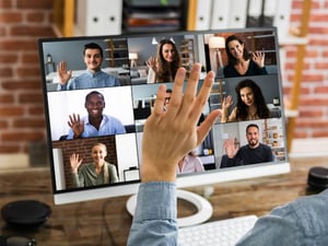 Blog Post Hero: hand raised in an online meeting