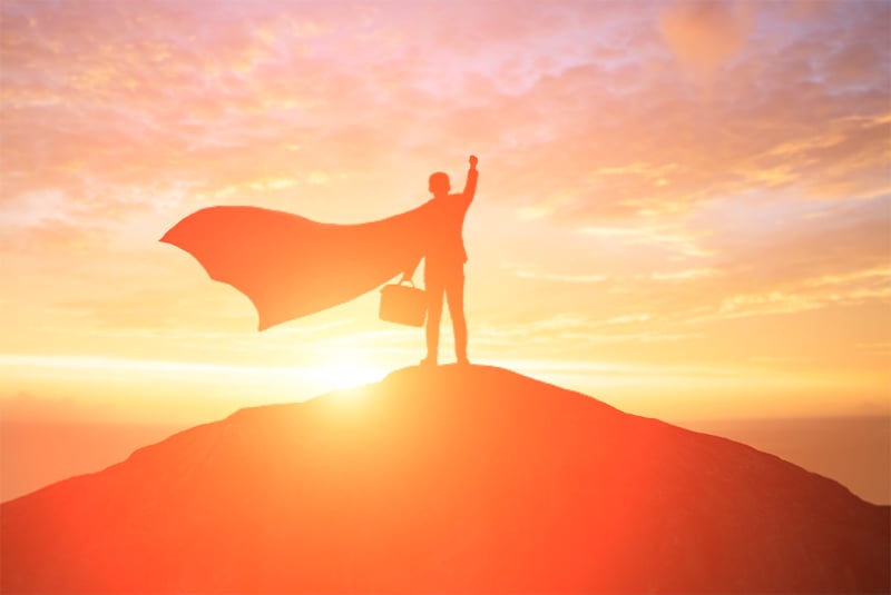 Blog Post Hero: a superhero on the top of a hill